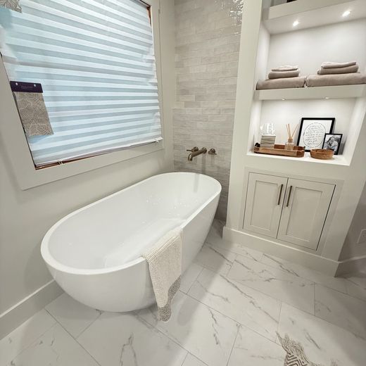 Freestanding tub with wall-mount brass filler